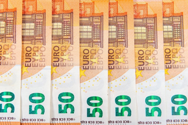 Photo pattern from 50 euro banknotes euro banknote as part of the economic and trading system closeup