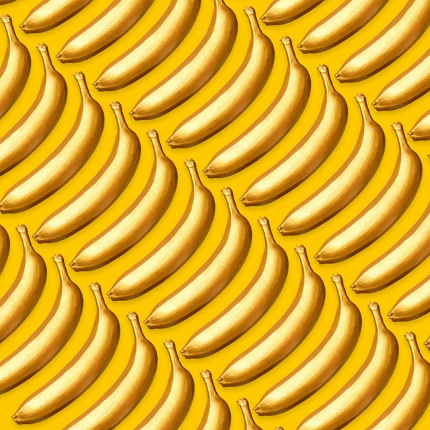 Photo pattern of golden bananas on a yellow background