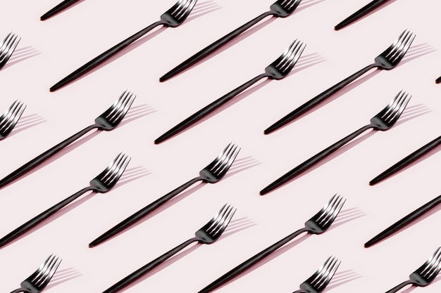 Pattern made of cutlery on pastel background, flat lay, top view. Fashion Minimalist concept.