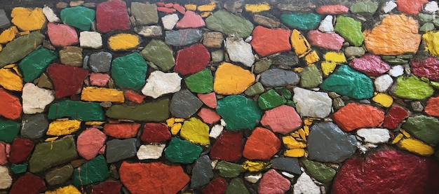 Pattern of old stone wall with multi-colored surface