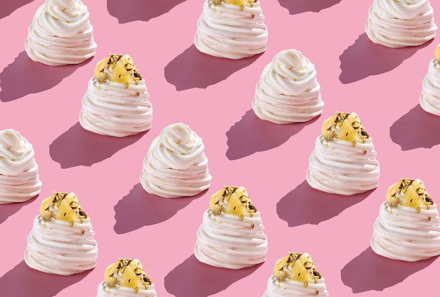 Pattern Pavlova cakes on a pink background with hard shadows