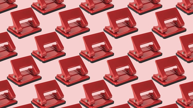 A pattern of red hole punches on a light pink background