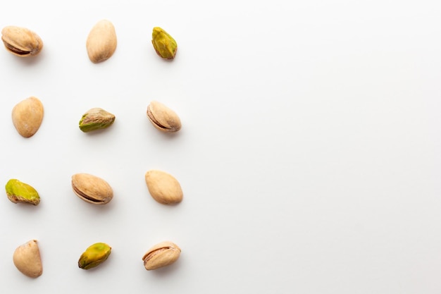 Pattern of roasted pistachios isolated on white background