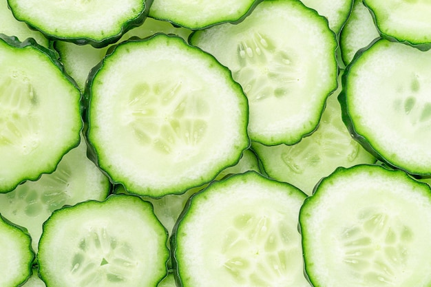 Pattern of sliced green cucumber, close up, top view.