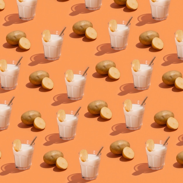 Pattern with milk and potato on beige background