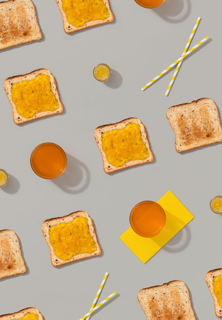 Pattern with toast and lemon jam on gray surface