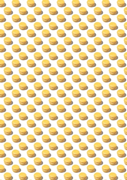 Pattern with yellow macarons on a white background