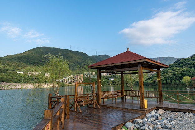 A pavilion by the lake in the country