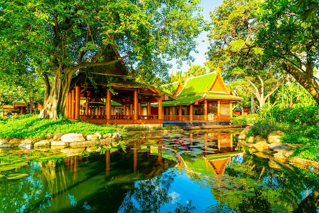 pavilion in Thai style with lake and tree in garden