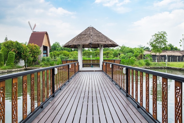 Pavilion wooden bridge on lake water