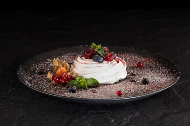 Pavlova is a meringue-based dessert named after the Russian ballerina Anna Pavlova. Copy space.