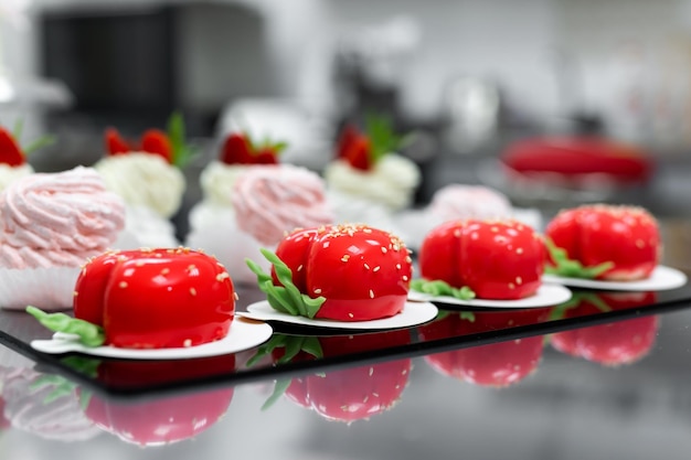 Pavlova meringue marshmallows and mousse cake on the table in the pastry shop