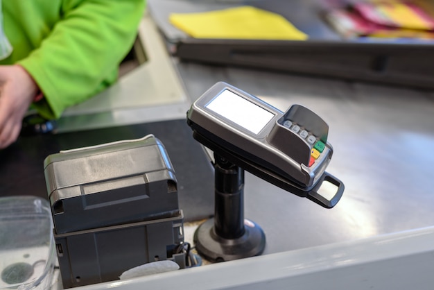 Photo payment terminal for plastic cards at the store with space for layout, mock up