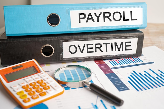 Payroll and Overtime Binder data finance report business with graph analysis in office