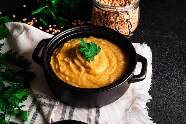 Pea puree on a dark background Mushy peas Pease pudding Pea porridge High quality photo