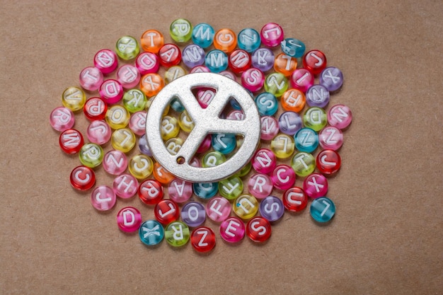 Peace icon an colorful abc beads