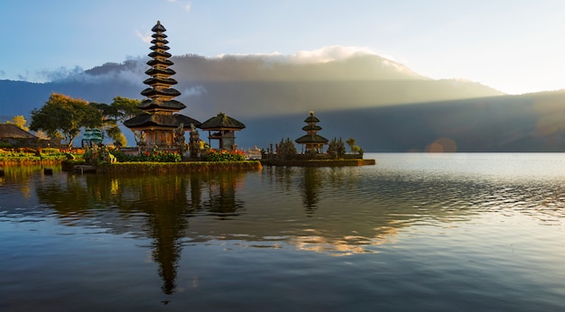 Peaceful atmosphere in early morning during sunrise over Pura Ulun Danu temple the Iconic of Bali, lake Bratan, Bali, Indonesia.