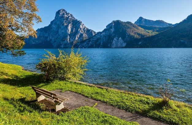 Peaceful autumn Alps mountain lake Morning view to Traunsee lake and Traunstein mountain in far Upper Austria