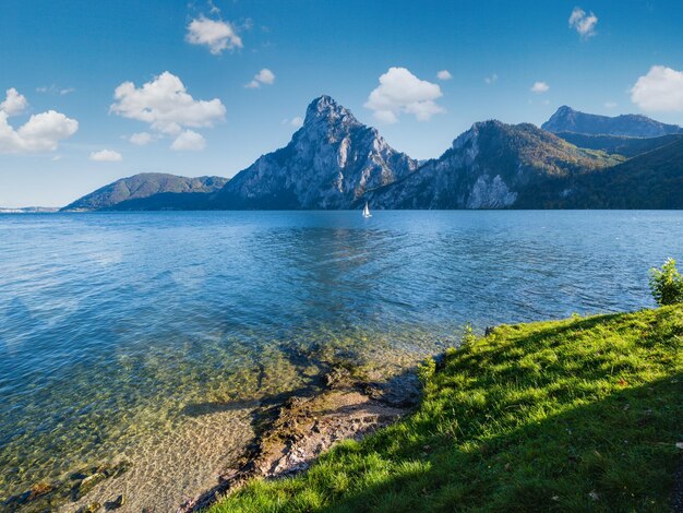 Peaceful autumn Alps mountain lake Morning view to Traunsee lake and Traunstein mountain in far Upper Austria