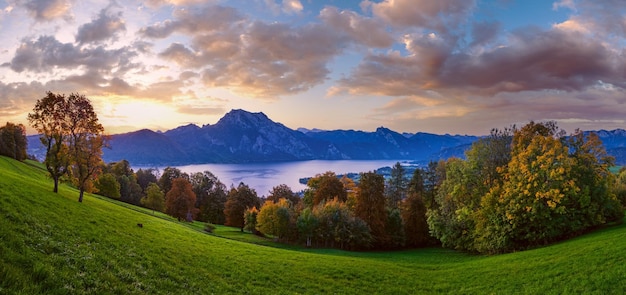 Peaceful autumn Alps mountain lake with clear transparent water and reflections Sunrise view to Traunsee lake Gmundnerberg Altmunster am Traunsee Upper Austria