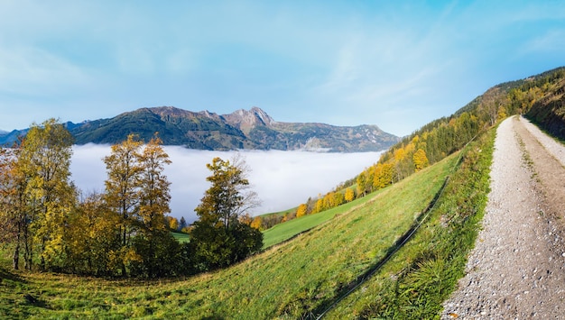 Peaceful misty autumn morning mountain view from hiking path from Dorfgastein to Paarseen lakes Land Salzburg Austria