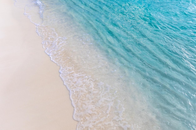 Peaceful sea, tropical beach nature. Soft wave of blue ocean on sandy beach. Peaceful meditation