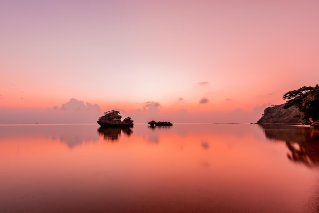 Peaceful seascape at dusk in pink shades