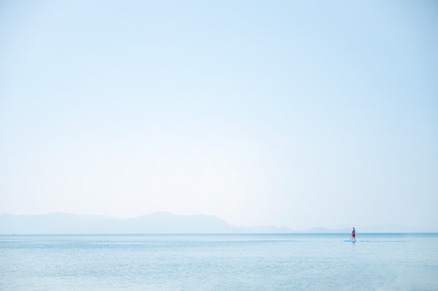 Peaceful seascape with light blue sky by the sea