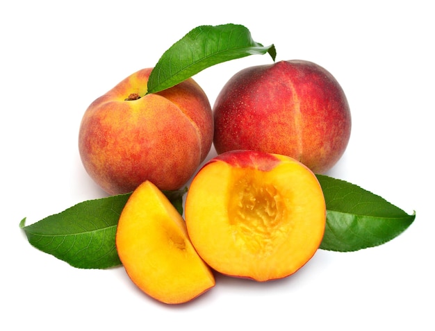 Peach fruit whole and half with leaf isolated on white background Perfectly retouched full depth of field on the photo Flat lay top view