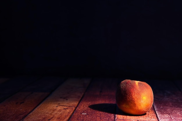 Peach o wooden background world food day