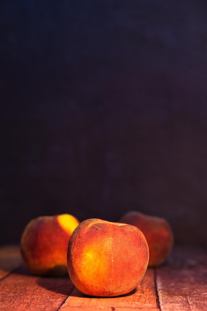 Peach o wooden background world food day