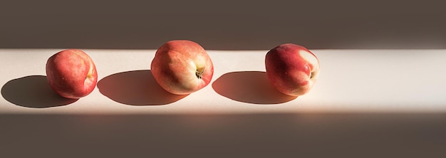 Peaches in sunlight Minimalism trendy still life with shadow