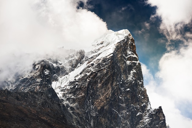 Peak of mount Taboche with clouds in Himalaya mountains. Khumbu valley, Everest region, Nepal