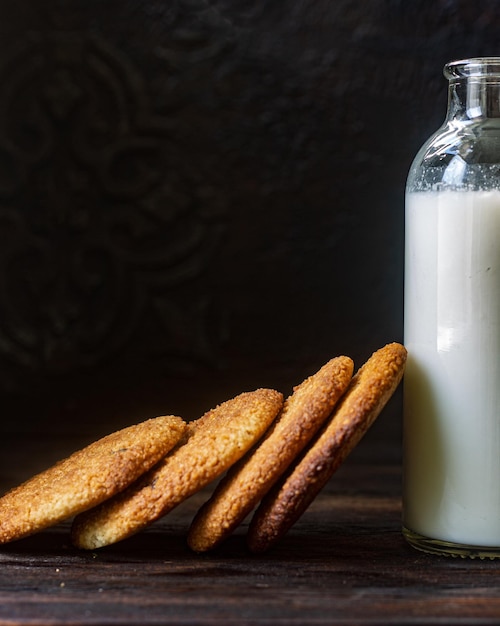 Peanut cookies and a bottle of milk