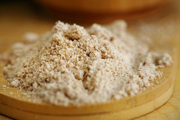 Peanut nuts flour on the wooden table