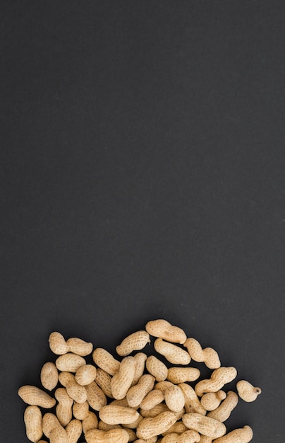 Peanuts in shell on black background