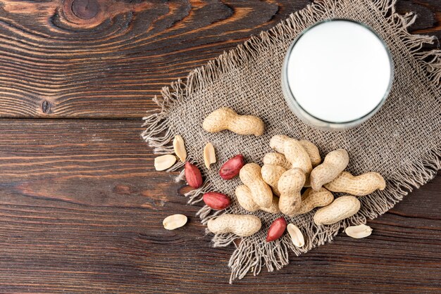 Peanuts with a glass of milk on the table