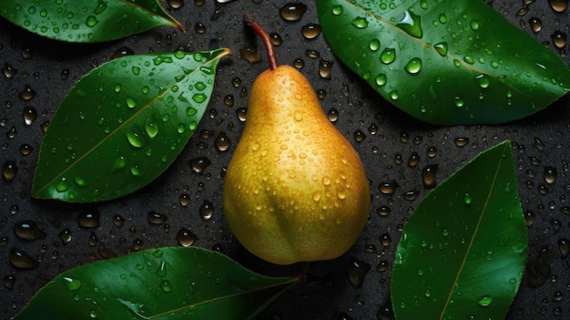 A pear on a black surface with green leaves on it.