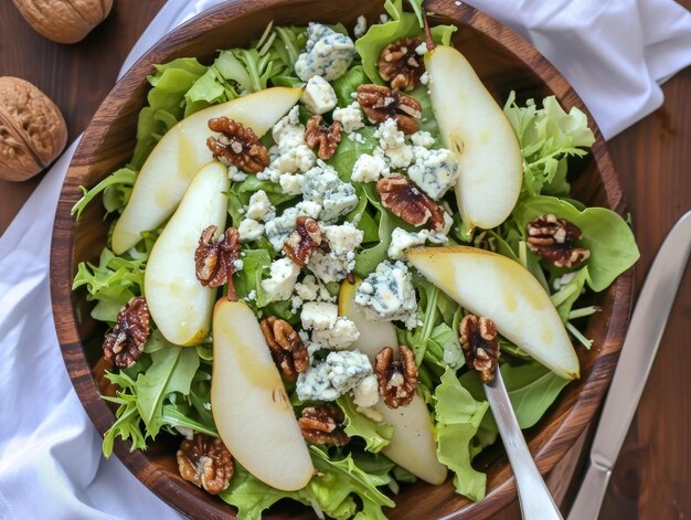 Photo a pear and blue cheese salad with mixed greens ripe pears crumbled blue cheese candied walnuts and a raspberry vinaigrette ar 43 stylize 50 v 6 job id 9d3af950abd343e98576d79cc7479e5f