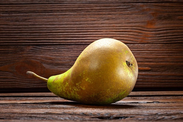 Pear on dark wooden background