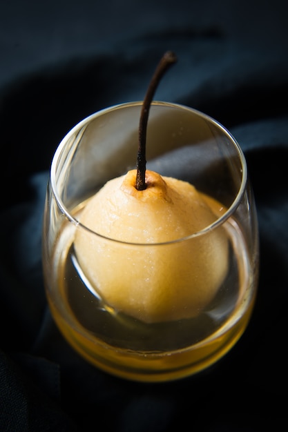 Pear poached in a glass, cooked