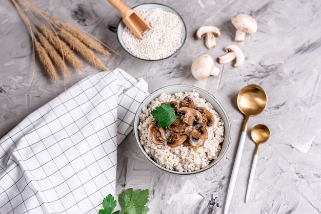 Pearl barley porridge with mushrooms, healthy food concept, breakfast