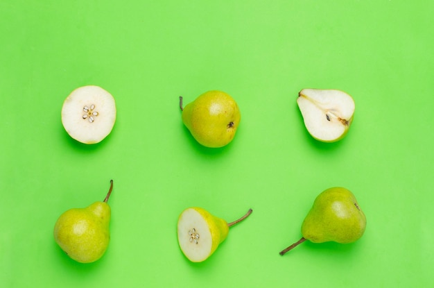 Pears on green backgroundFresh and healthy fruitsClose up