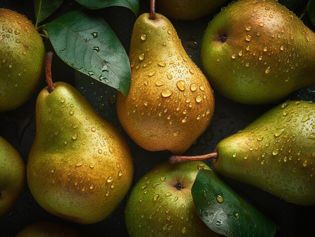 Pears with green leaves on a dark surface