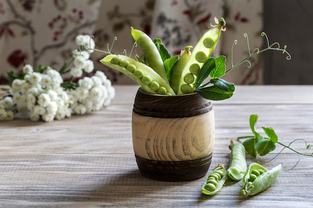 Peas in a vase.