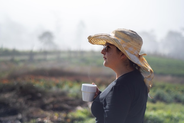 peasant woman with cup of coffee on cloudy day