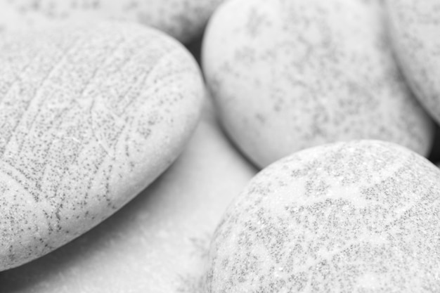 Pebbles background abstract background with dry round gray reeble stones gray closeup pebbles background spa relaxation concept