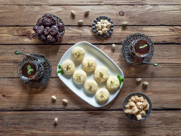 Peda (Indian sweet), Milk Fudge in a wooden table.  Top view.