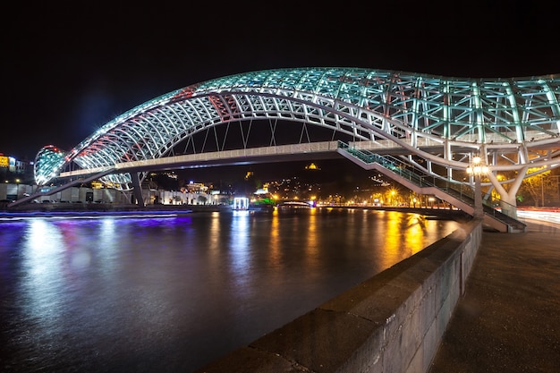 Pedestrian bridge of peace over the Mtkvari (Kura) River in Tbilisi at night