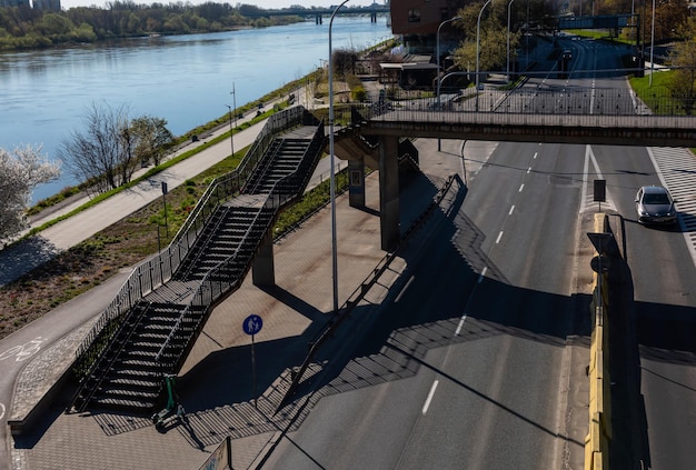 Pedestrian bridge with stairs over the highway